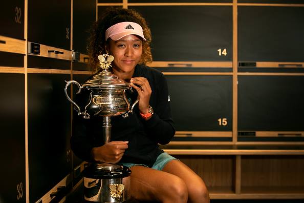 naomi osaka holding trophy