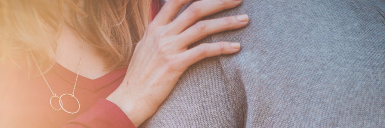 How To Stop Thinking About Someone When You Have OCD woman holding a man's arm