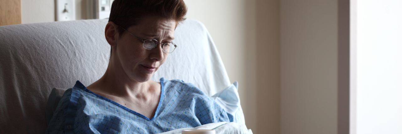 How to Make Patient Volunteers Feel Valued photo of female patient with short hair sitting in hospital bed holding cup of soup