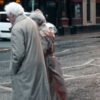elderly couple crossing the street