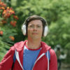 Ryan, the main character in "Special" wearing headphones outside.