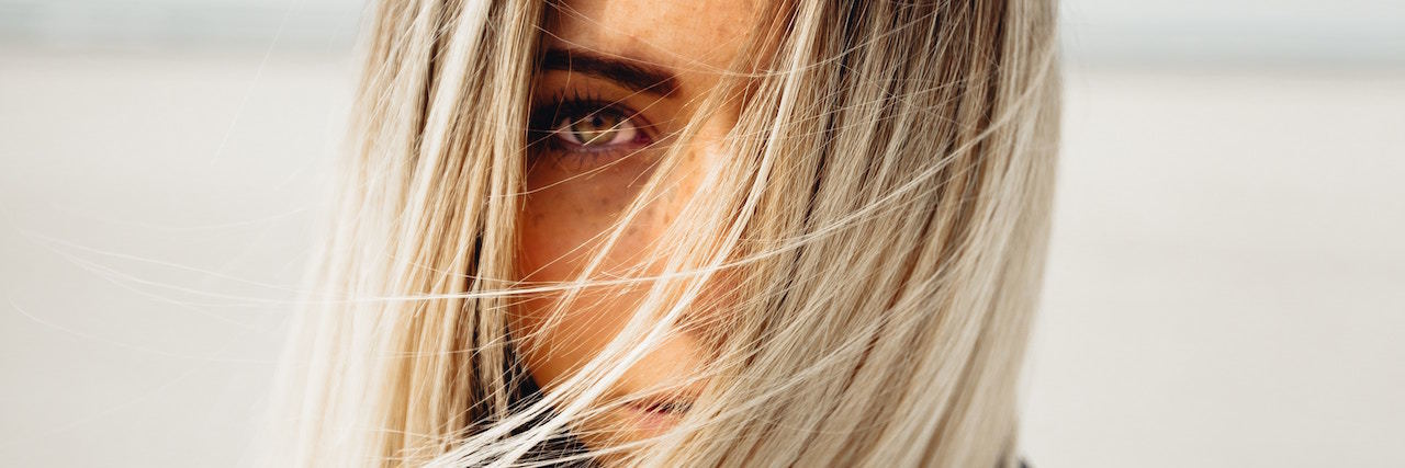 PTSD: When Trauma Makes You Afraid of Nothing a woman with her hair covering her face