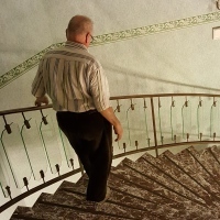 man walking down spiral staircase