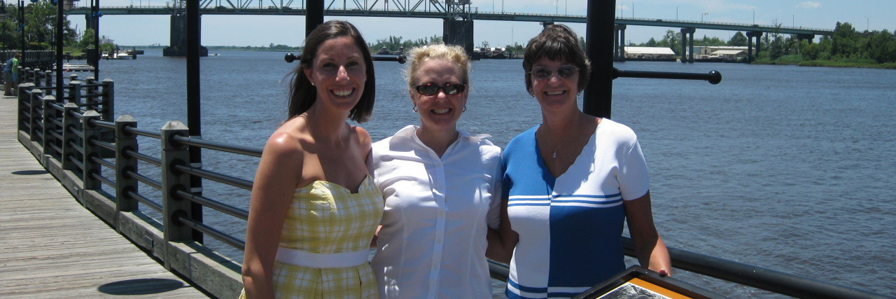 Mother's Day Wishes for Grieving Women A woman with her mother and mother-in-law.