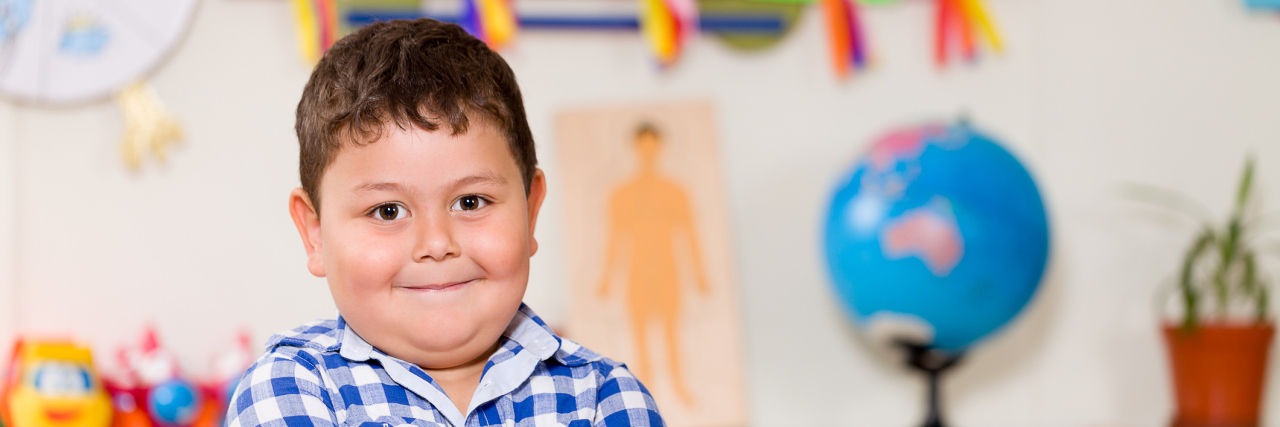 This Is What I Want Most for My Child on the Autism Spectrum Boy with arms crossed smiling at camera