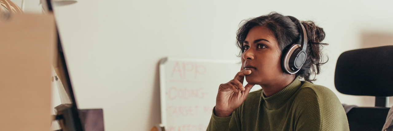 Getting Job Accommodations Because of Ehlers-Danlos Syndrome Woman working at computer in office.