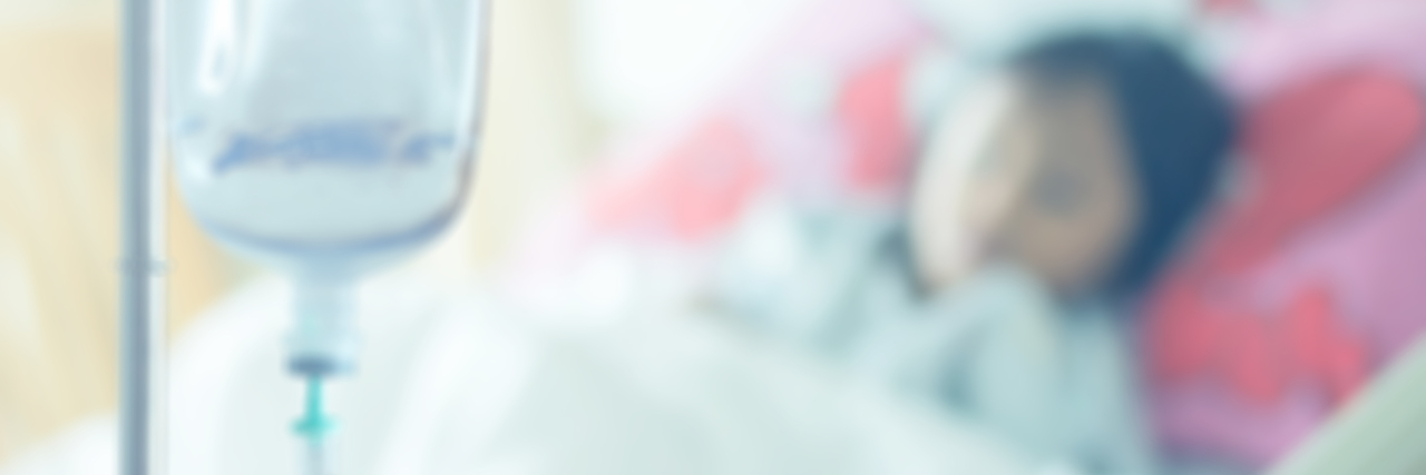 FDA Approves Novartis' Zolgensma for Spinal Muscular Atrophy (SMA) patient on bed at saline solution at hospital blurry background