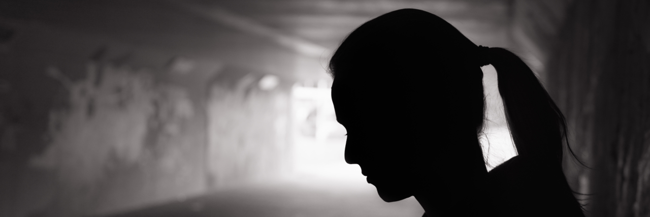 Letting Go of Shame Surrounding Multiple Sclerosis Silhouette of woman.