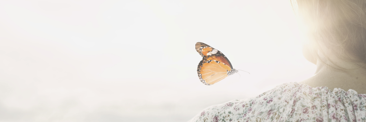 Finding Myself Again After a Traumatic Brain Injury Butterfly landing on a woman's shoulder.