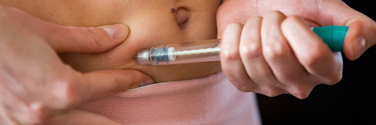 What You Should Know Before Starting Fertility Treatments a woman is making on a hormone injection on her stomach