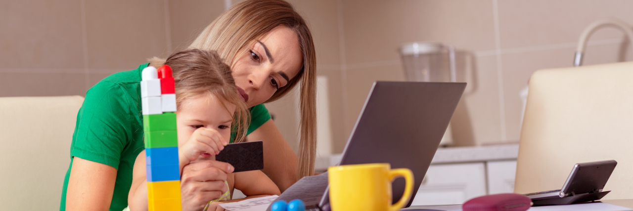 My Thoughts About the 'Advocate Like a Mother' Theory a mother and daughter sitting together at a desk while mom works