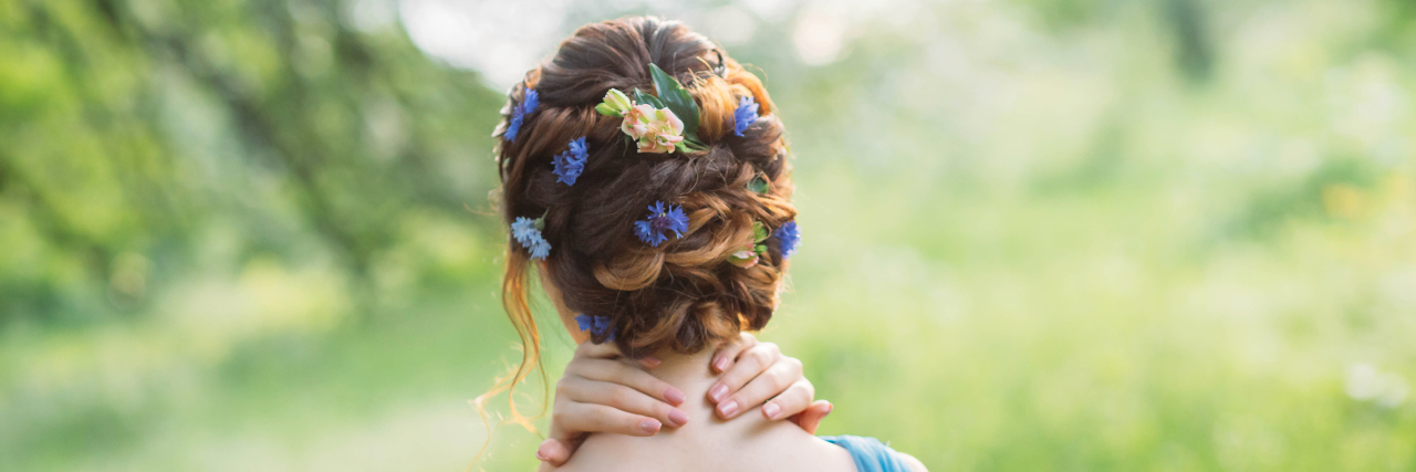 Woman with flowers in her hair.