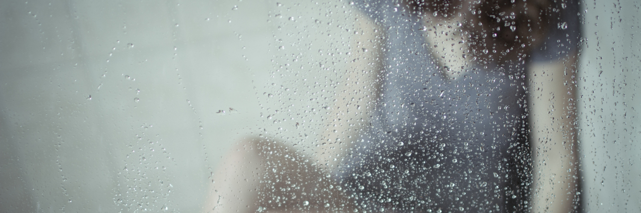 The Void of Depression and Anxiety a young woman sitting on floor of shower