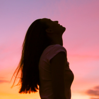 Woman looking up into the sky.
