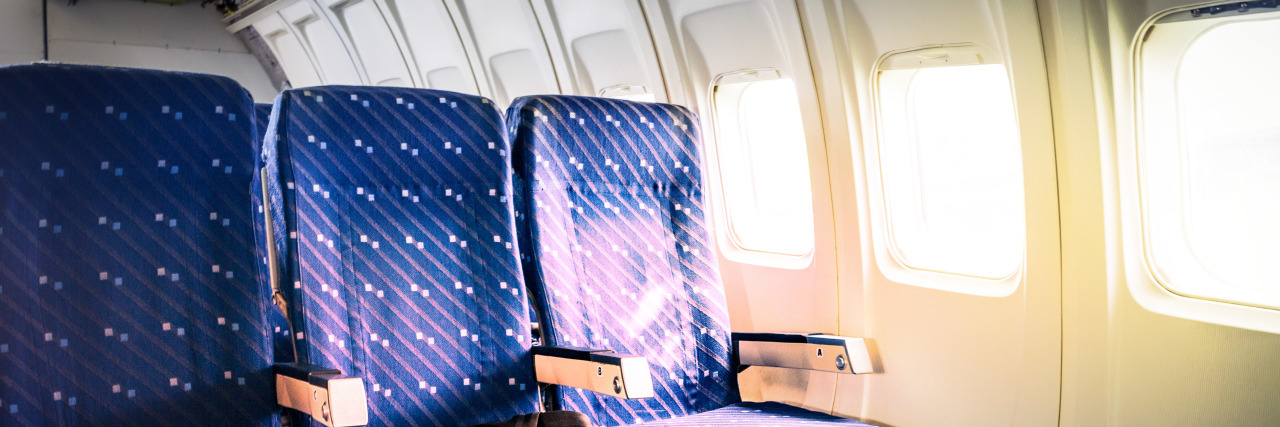 Traveling When You Can't Sit Due to an Invisible Disability Row of empty airplane seats.