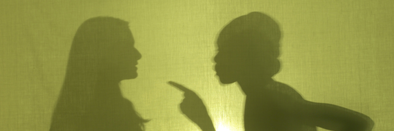 8 Things Not to Say to Someone With Chronic Illness Silhouette of woman scolding another woman.