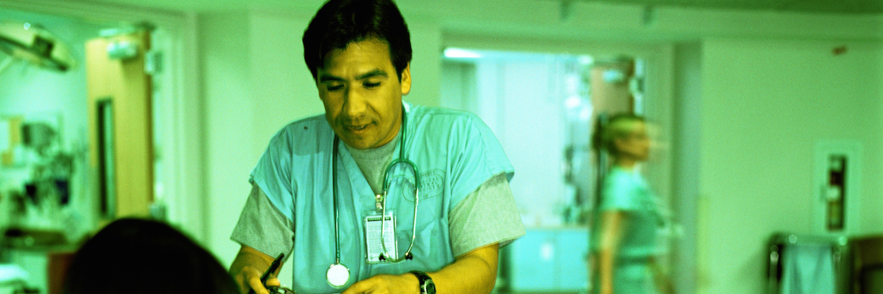 What Admission to a Psychiatric Hospital Is Really Like Doctor talking to receptionist in emergency room