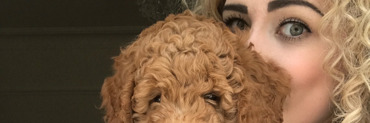 How Getting a Dog Has Helped My Mental Health blonde woman posing with goldendoodle (golden retriever and poodle cross) puppy