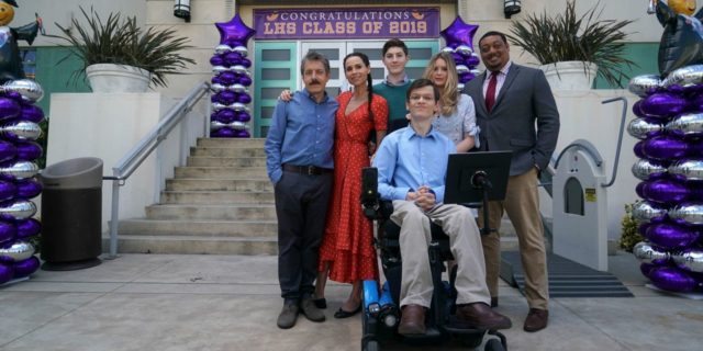 Cast of the ABC TV comedy "Speechless" outside the door of a high school