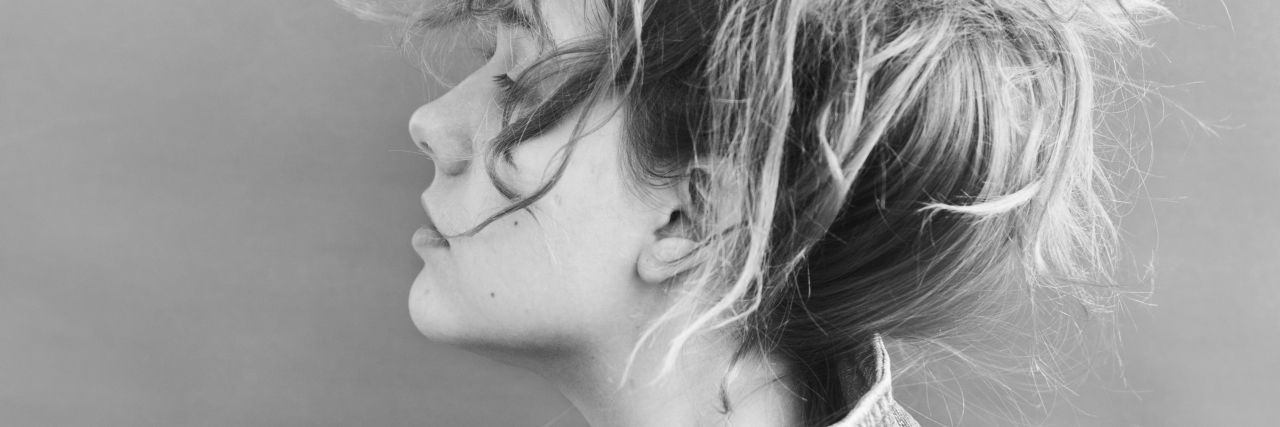 Why Was I Sexually Abused? black and white photo of blonde woman in profile view with hand on collar of jacket