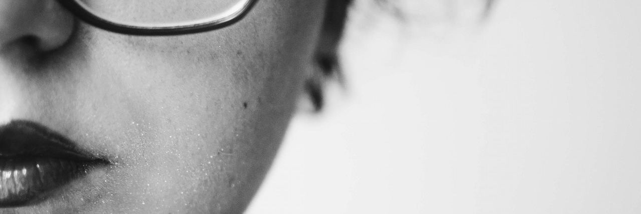 What Grieving Is Like When You Have Borderline Personality Disorder Black and white portrait of woman wearing classes