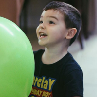 Barclay enjoying a green balloon on his birthday.