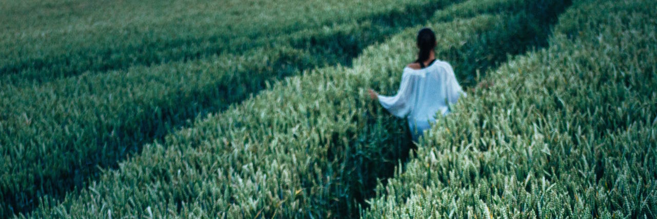 A woman walking in a field