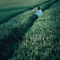 A woman walking in a field