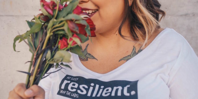 What 'Self-Care' Means When You Have Bipolar Disorder A woman smelling a flower