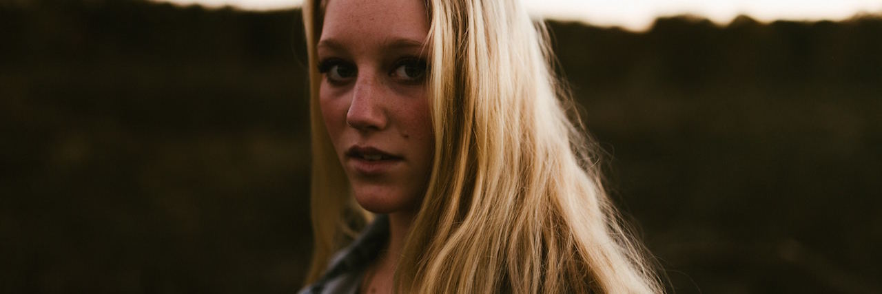 It's OK If You Can't Forgive Your Abuser as a Trauma Survivor A woman with blonde hair