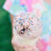 close up photo of ice cream held by little girl