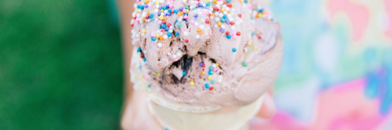 My Little Girl Said Her Thighs Are 'Chubby' close up photo of ice cream held by little girl