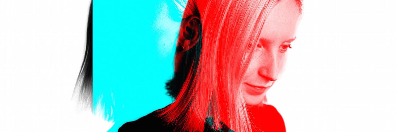 What to Know If You're Unemployed Because of Mental Illness A woman looking down, her image is red with a dark shadow