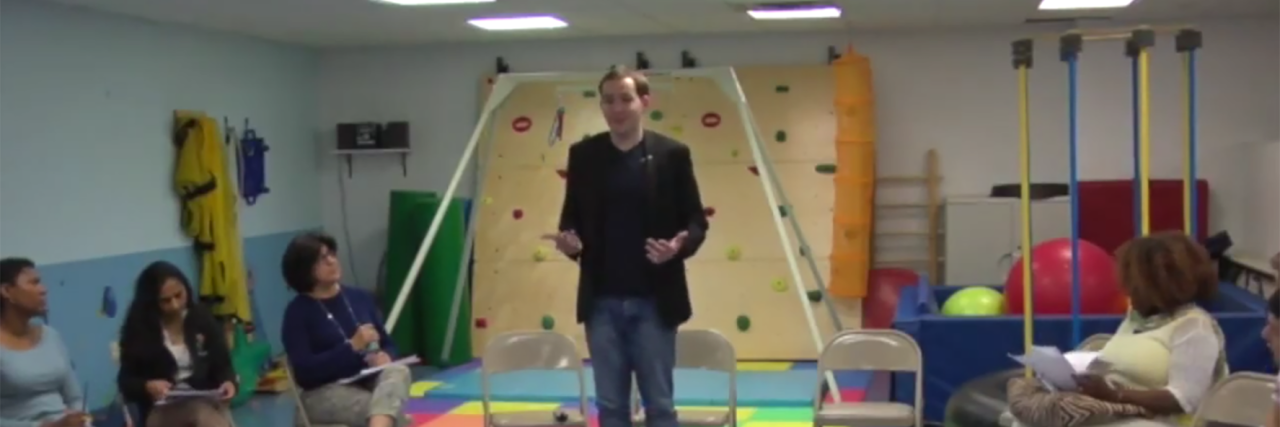 My Journey From Nonverbal Autism to Public Speaking Kerry Magro speaking to a group of therapists.