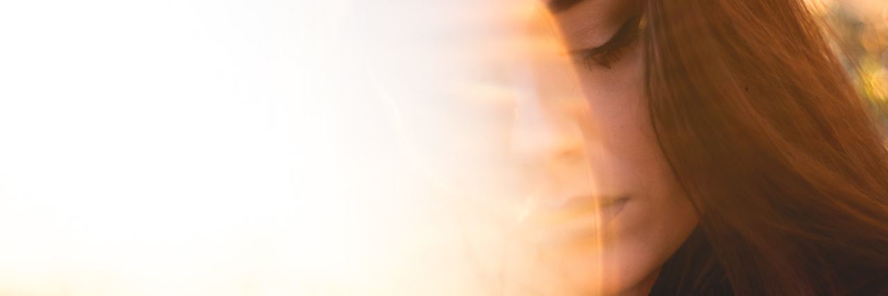 To My Psychiatrist, From The Patient You Are Saving. photo of woman in bright light flare with eyes closed