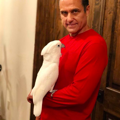 Image of Maurice Benard holding a white bird