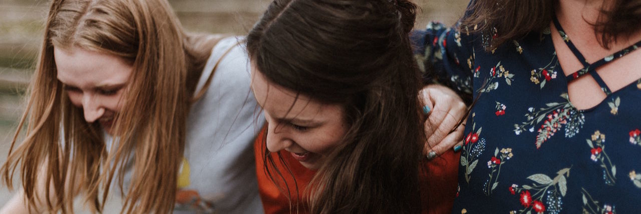 How Borderline Personality Disorder Both Helps and Hurts Friendships Group of girls laughing with their arms around each other