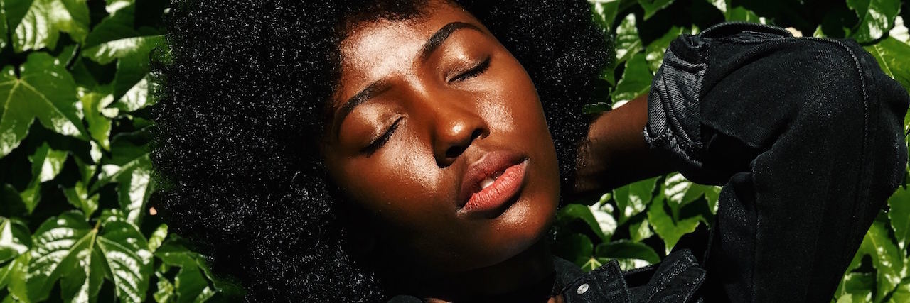 Losing Your Job and Home Because of Anxiety and Depression A black woman against a bush
