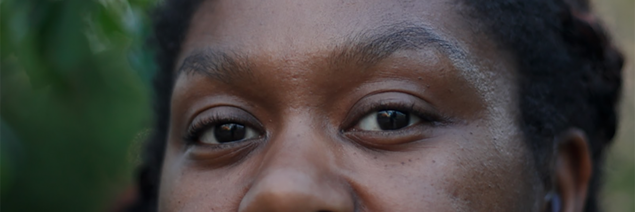 Learning About Deaf Culture and ASL as a Deaf Teen Photo of Ruth Jackson, a young Black woman, focusing on her eyes.