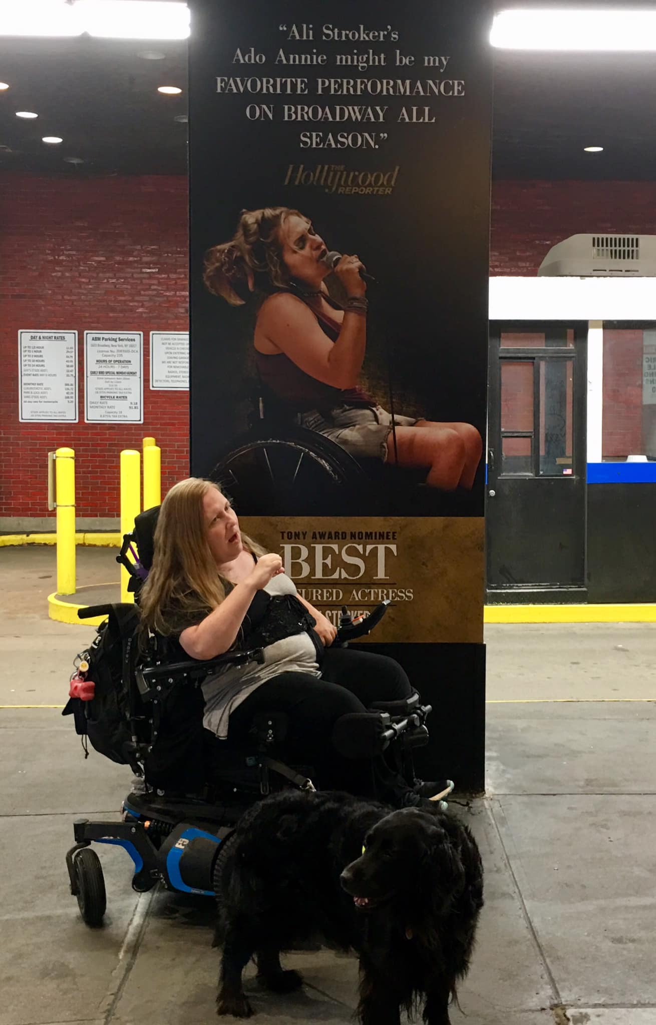 Karin Willison poses with a poster of Ali Stroker as Ado Annie in "Oklahoma," outside the Circle in the Square Theatre in New York, NY.