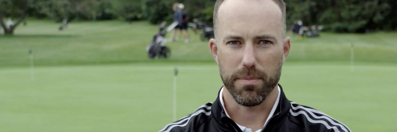 Men: It’s OK to Stop Hiding That You’re Struggling photo of professional golfer andrew jensen with crossed arms in front of golf course