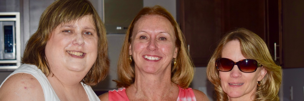 Long-Term Stroke Survivor: My Life 15 Years After a Stroke Maggie with friends in a kitchen.