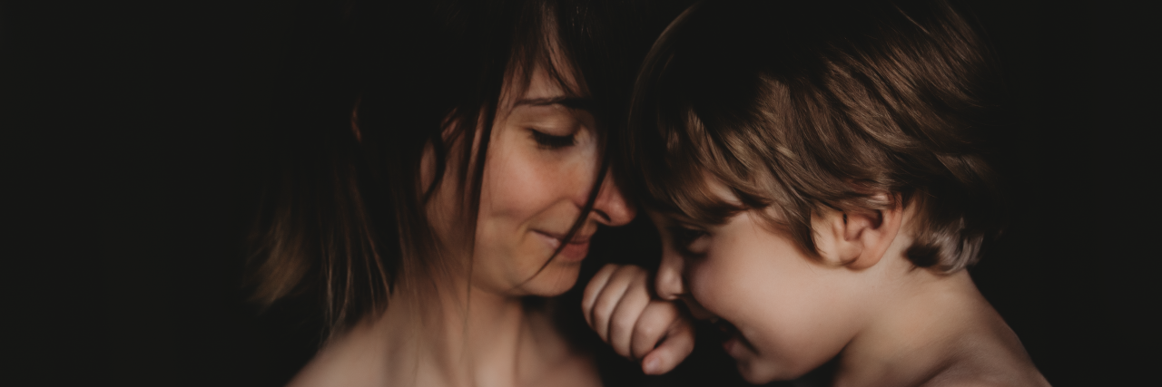 6 Misconceptions About Autism Debunked By an Autistic Adult Eileen and her son Charlie cuddling.