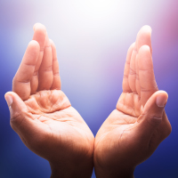 Hands holding light; spiritual healing.