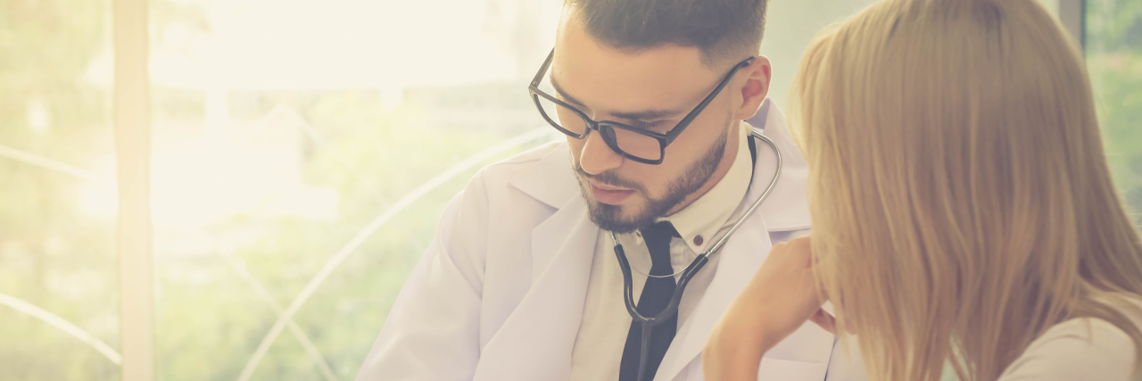 Listening to Your Body as a Person With Chronic Illness a male doctor is talking to a woman