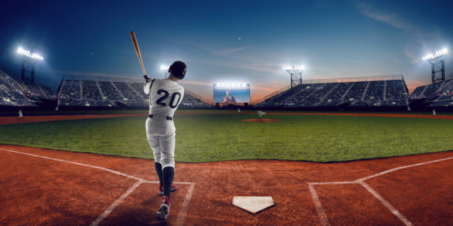 When I Found Out My Life-Changing Injury Could Have Been Prevented Baseball player hitting ball in stadium.