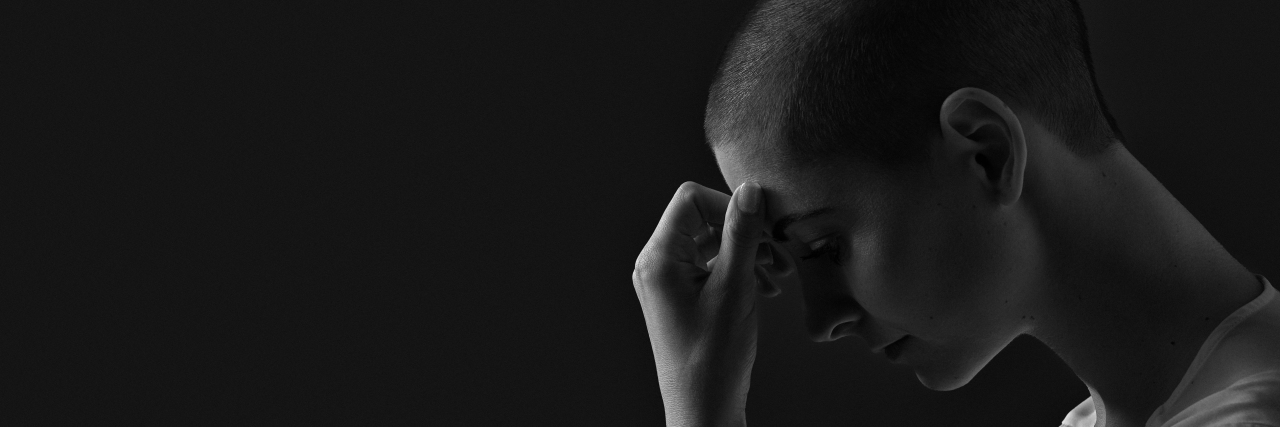 Please Stop Telling Me to 'Be Strong' as I Battle Depression a woman looking down and sad