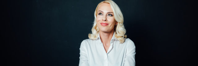 Portrait of a blonde woman in a white shirt