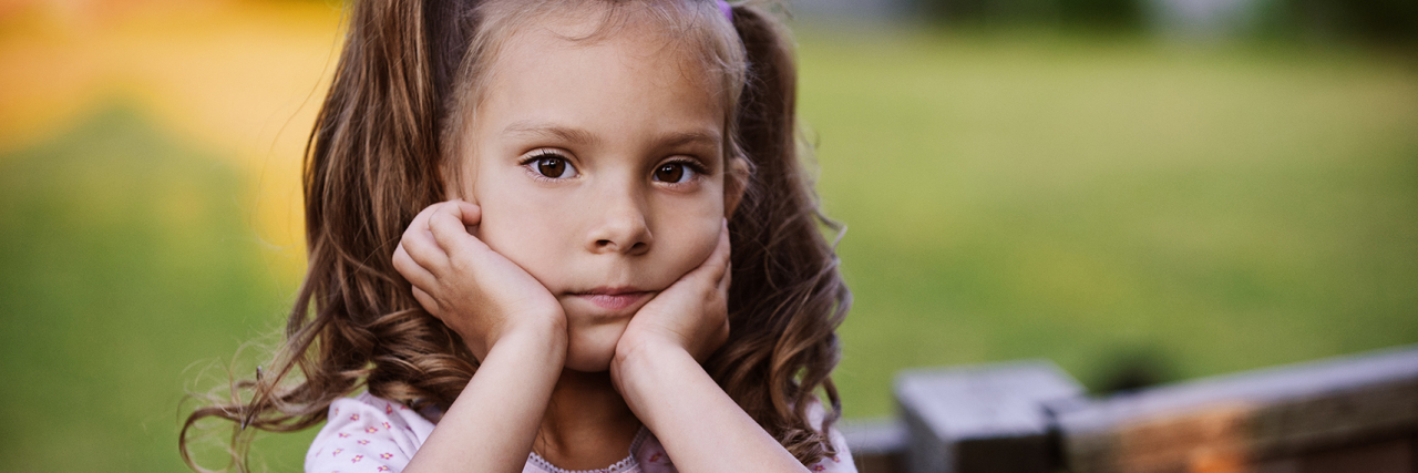 Child-on-Child Sexual Abuse Is Still Real Abuse A young girl with pigtails resting her head on her hands