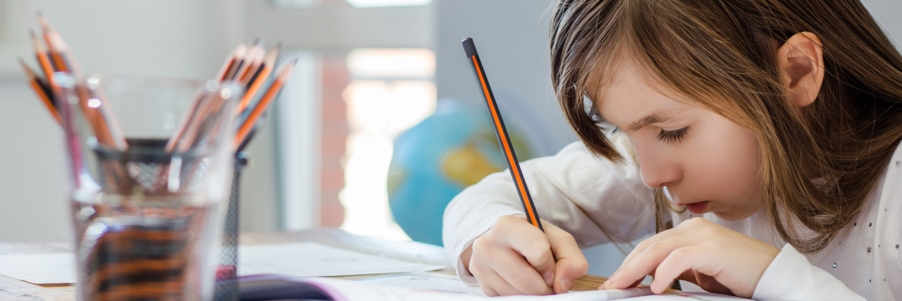 An Open Letter to Teens Growing Up With Learning Disabilities Young girl doing homework.